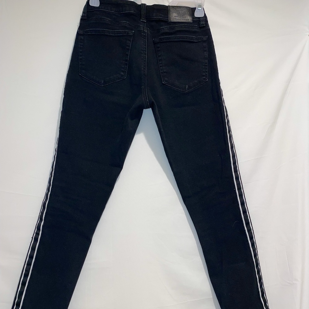 black jeans with strip on the sides